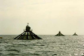 Three Farmocean offshore cages in semi-submerged position. ACQUA AZZURRA