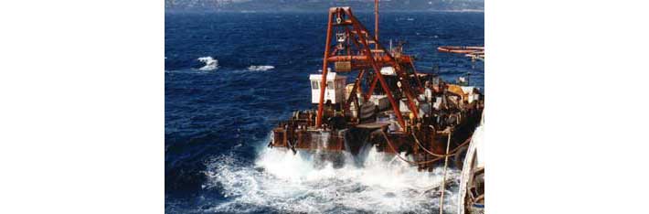 Barge used to drop 10 tons concrete blocks for offshore fish farming facility.